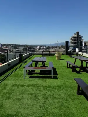 a group of picnic tables on top of a roof at Dpto centrico in Villa Carlos Paz