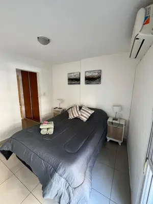 a bedroom with a large bed in a room at Jardines del Boulevard in Cordoba