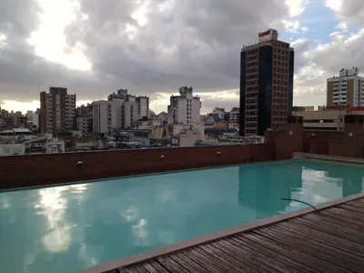 a swimming pool on top of a building with a city at Jardines del Boulevard in Cordoba