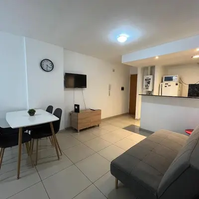 a living room with a couch and a table at Jardines del Boulevard in Cordoba