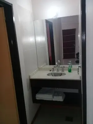 a bathroom with a sink and a mirror at Departamento en Carlos Paz para familias in Villa Carlos Paz