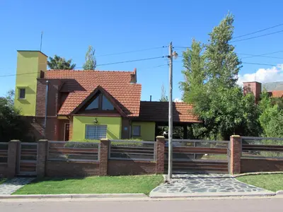 a house with a fence in front of it at Chalet Individual Maiten 2 in Merlo