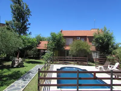 a backyard with a pool and a house at Chalet Individual Maiten 2 in Merlo