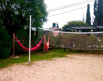 a volleyball net in the middle of a field at Cabañas Kehuen in Villa Amancay