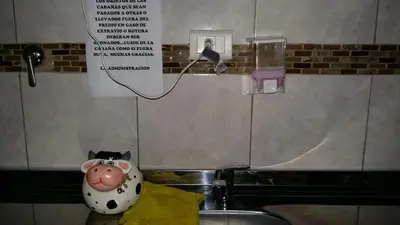 a cow toy sitting on top of a sink at Cabañas Kehuen in Villa Amancay