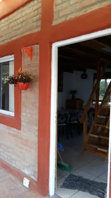 an open door of a building with a stair case at Cabañas Kehuen in Villa Amancay