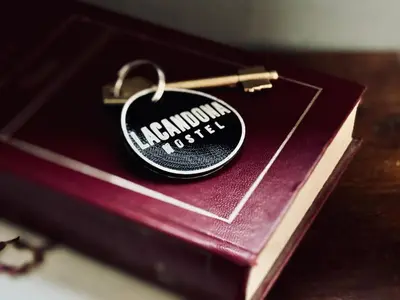 a key chain sitting on top of a book at Lacandona Hostel in Cordoba