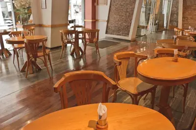a dining room with wooden tables and chairs at Hotel Felipe II in Cordoba