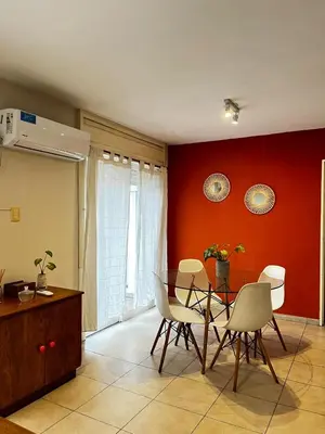 a dining room with a table and chairs at El Abrojal - Departamento con Estacionamiento , zona Patio Olmos in Cordoba