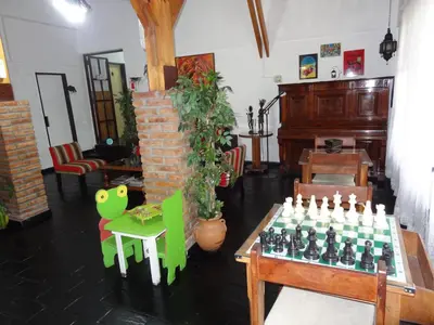 a room with a table with a chess board on it at Hostería Lida in Merlo