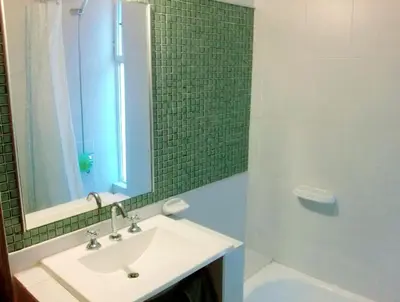 a bathroom with a sink and a shower with a mirror at Espacio C Av Marcelo t de Alvear Vista Centro in Cordoba