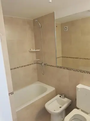 a bathroom with a tub and a toilet and a sink at Colón in Cordoba