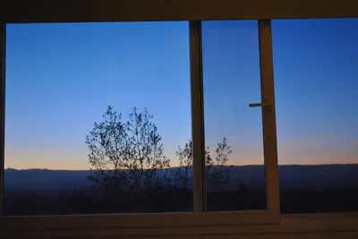 a window with a view of a tree at La Fleur in Villa General Belgrano
