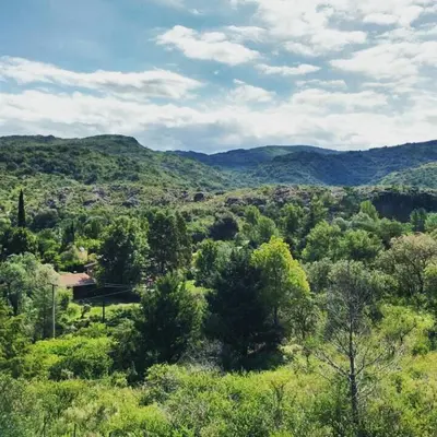 a view of a valley with trees and mountains at Cuesta los Robles -Casas Serranas- in Villa Icho Cruz