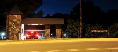 a fire truck parked in a gas station at night at Cabañas Alpendorf in Villa General Belgrano