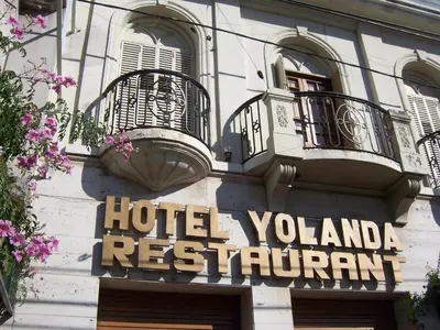 a hotel sign on the side of a building at Cordoba Yolanda Hotel in Cordoba