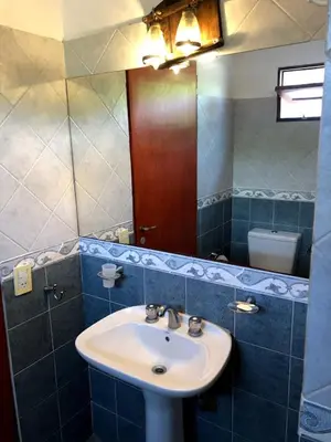 a bathroom with a sink and a mirror at Casa Loft Rumipal in Villa Rumipal