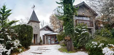 a house with a cross on top of it at Posada del Sauce in Villa General Belgrano