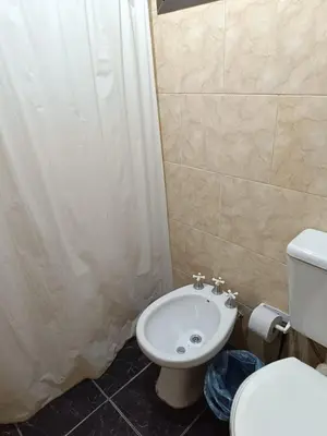 a bathroom with a toilet and a sink at Bosquecito de Carpin in Carpintería