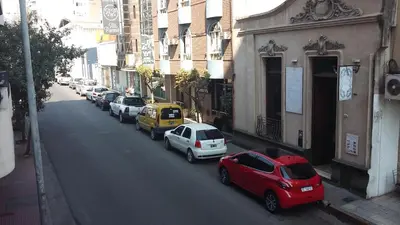 a group of cars parked on the side of a street at mi depto en cba in Cordoba