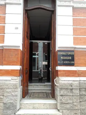 an open door to a building with a sign on it at mi depto en cba in Cordoba