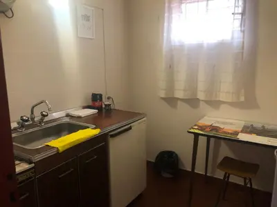 a small kitchen with a sink and a window at Departamentos Centricos Carlos Paz in Villa Carlos Paz