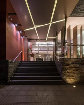 a set of stairs in a building with lights at Hotel Estilo MB - Villa Carlos Paz in Villa Carlos Paz