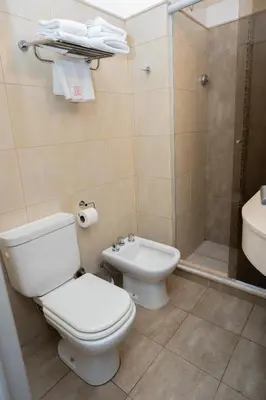 a bathroom with a toilet and a sink and a shower at Kube Apartments Express in Cordoba