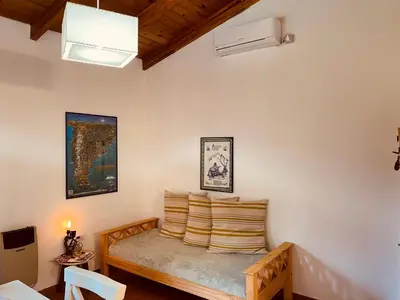 a room with a bed with pillows on it at Preludio De Luxe in Villa General Belgrano