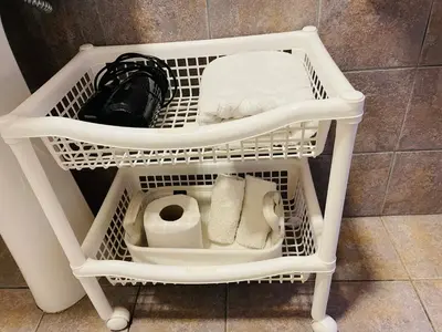 a shelf with toilet paper and towels in a bathroom at Preludio De Luxe in Villa General Belgrano