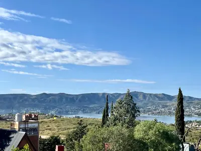 a view of a city and a body of water at Hermosa casa con vista al lago in Villa Carlos Paz