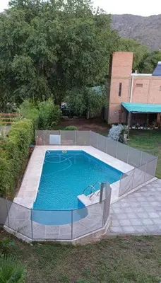 a large swimming pool in a yard with at Costa Dorada in San Antonio de Arredondo