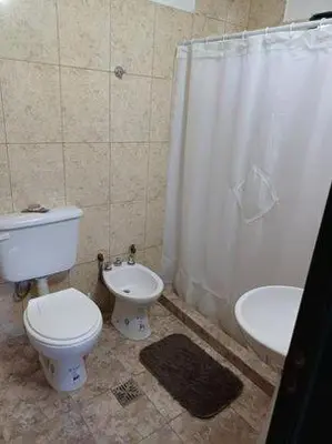 a bathroom with a toilet and a sink at Costa Dorada in San Antonio de Arredondo