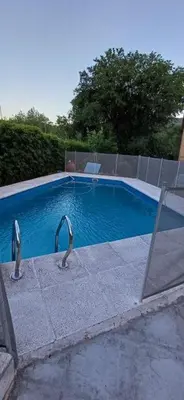 a swimming pool with two birds in the water at Costa Dorada in San Antonio de Arredondo