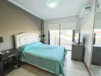 a hospital room with a bed and a television at Constantino Iii in Villa Carlos Paz