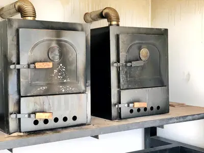 two ovens sitting on a shelf in a kitchen at Vow in Villa Carlos Paz