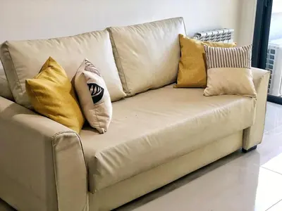 a couch with pillows on it in a living room at Vow in Villa Carlos Paz