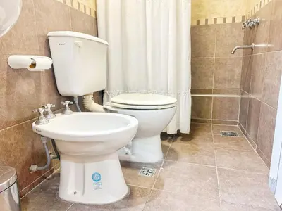 a bathroom with a toilet and a shower at Miralejos Ii in Villa Carlos Paz
