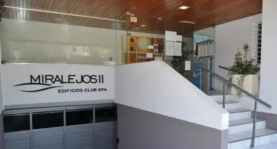 a building with a sign that reads mirale os skill at Miralejos Ii in Villa Carlos Paz