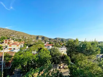 a view of a town in the hills at Awa in Villa Carlos Paz