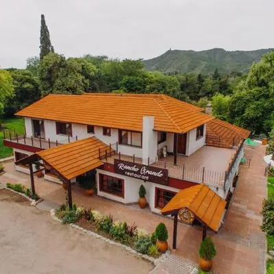 an overhead view of a building with an orange roof at Rancho Grande Hotel in Villa General Belgrano