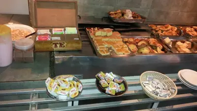 a buffet line with many different types of food at HOTEL COLONIAL in Villa Carlos Paz