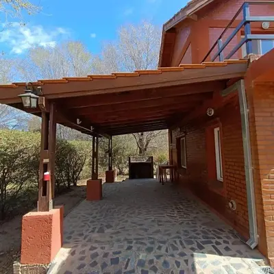 awning over the entrance to a brick building at Cabañas Peñihue in Carpintería