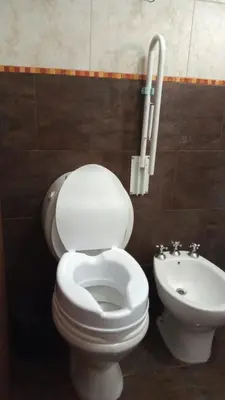 a bathroom with a white toilet and a bidet at Cabañas La Herradura in Villa Ciudad Parque