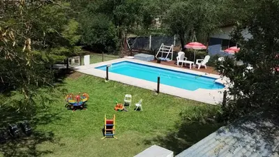 an overhead view of a swimming pool in a yard at Cabañas La Herradura in Villa Ciudad Parque