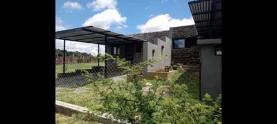 a house with a view of the garden at Waylla in Panaholma