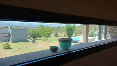 a window with two vases sitting on a window sill at Waylla in Panaholma
