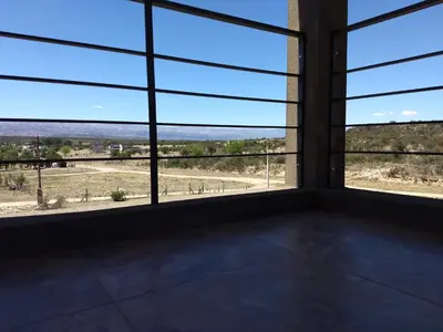 a room with large windows with a view of a field at Waylla in Panaholma