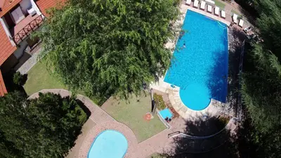 an overhead view of a large swimming pool at CABAÑAS VIEJO VIVERO in Mina Clavero