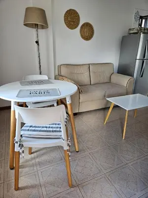 a living room with a table and a couch at Depto VCP Rental in Villa Carlos Paz